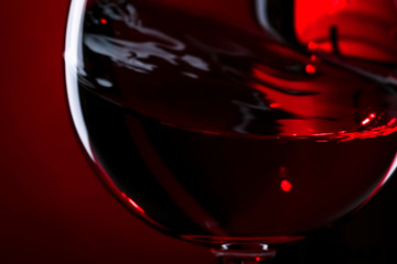Blurred Red wine on red black background, abstract splashing. Macro shot