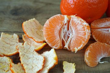 Delicious tangerines on wooden table