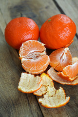 Delicious tangerines on wooden table