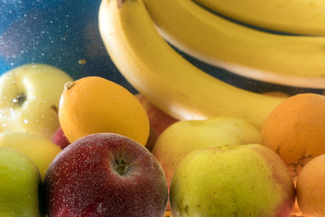lot of fresh fruit splashing in fresh water