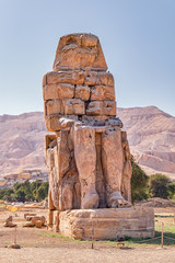 Colossi of Memnon, massive stone statues of the Pharaoh Amenhotep III in the Valley of Kings, Luxor, Egypt