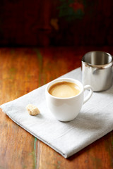 Cup of coffee on rustic wooden background