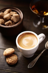 Cup of coffee on rustic wooden background