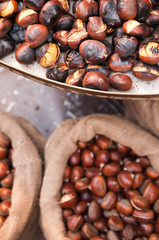 chestnuts ares old in the street of rome in winter time, christmas holidays, street food image.