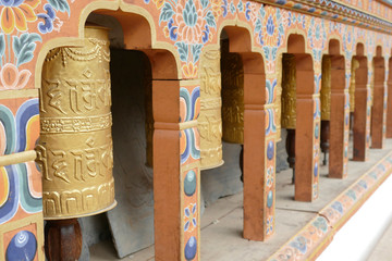 Prayer wheels repeating Buddhist mantra