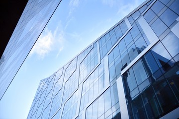 Fototapeta na wymiar Abstract reflection of modern city glass facades