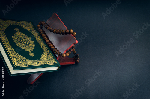 Holy Quran with arabic calligraphies translation meaning of Al-Quran -  stock photo - Crushpixel
