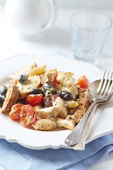  Penne pasta with fried pork tenderloin, cherry tomatoes and black olives. Oven baked.