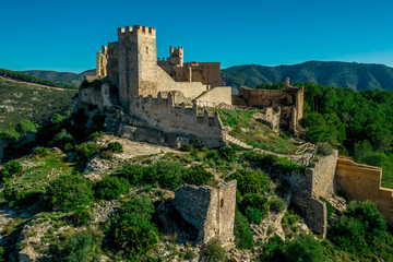 Aerial panorama view of Alcala de Xivert (Alcalá de Chivert) medieval Templar knight castle ruins in Valencia province Spain