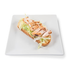 Caesar salad toast with lettuce and chicken slices