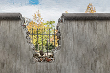Political barricade that limits freedom. Broken wall that symbolizes freedom