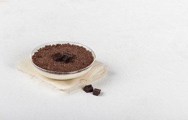 Vanilla Panna cotta, Italian dessert creamy jelly with chocolate chips and chocolate pieces on a light background, tiramisu