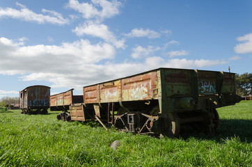 Fototapeta na wymiar Abandoned train wagons at Rauch station, Buenos Aires, Argentina