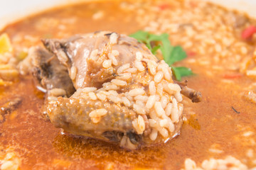 A dish of rice with partridge and artichokes