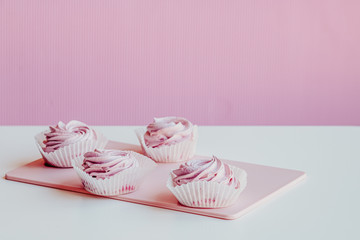 Soft pink marshmallows on the table.