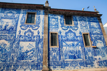 Beautiful antique wall of the Chapel of Souls of Santa Catarina decorated with traditional portuguese azulejos