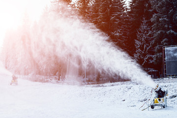 Snow cannon throws snow. Ski resort. Piece snow