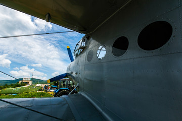 Novonezhino, Russia - Old helicopter rotor plane on a green airfield. Old rustic airfield with propeller aircraft.