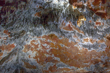 The brown and white ceiling in the cave with tiny gray straws.Yarrangobilly Caves, Kosciuszko National Park, NSW, Australia.