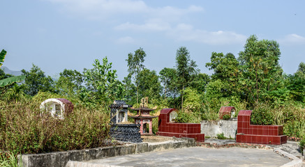 Fototapeta na wymiar Small Rural Village Cemetery in Quảng Ninh Province Half Way between Hanoi and Halong Bay Vietnam