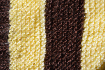 Handmade knitted fabric yellow brown wool background texture
