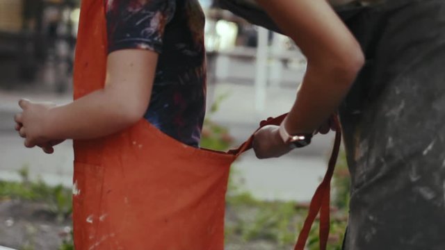 Slow Motion, Woman Teacher of Pottery Art Strikes An Apron on The Apprentice