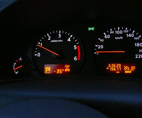 Car dashboard. The temperature in Finland in winter, overboard is -35 degrees Celsius (-31...