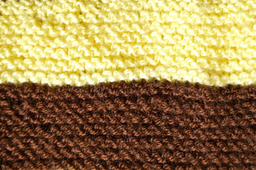 Handmade knitted fabric yellow brown wool background texture