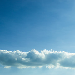 Fototapeta premium fluffy cloud above clear blue sky