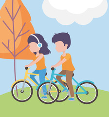 couple riding bike, woman with headphones in the grass healthy lifestyle