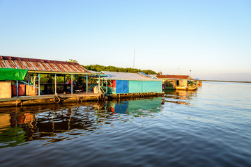 Fototapeta na wymiar The Floating Village of Kampong Khleang on Tonle Sap Lake at Siem Reap Cambodia During Sunset