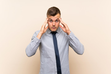 Young blonde businessman over isolated background unhappy and frustrated with something. Negative facial expression