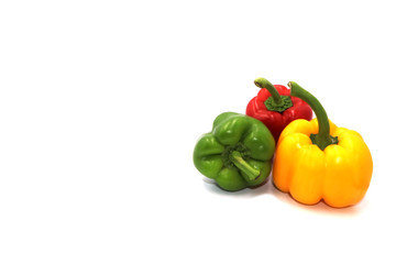 Sweet peppers, colorful vegetables placed on a white background