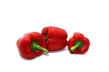 Sweet peppers, colorful vegetables placed on a white background