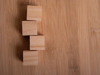 Wooden floor with empty wooden cubes as a template for words