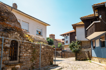 Fototapeta na wymiar Ancient ruins and old town street in Nessebar, Bulgaria