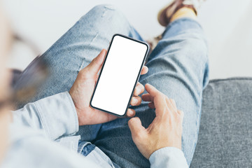 Mockup image blank white screen cell phone.hand holding texting using mobile background empty space for advertise text.people contact marketing business,technology 