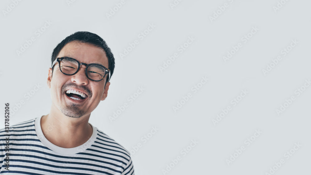 Wall mural portrait young asian man wear eye glasses smiling cheerful look thinking position with perfect clean