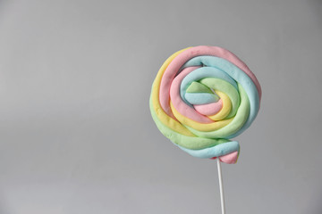 rainbow lollipop on white ground