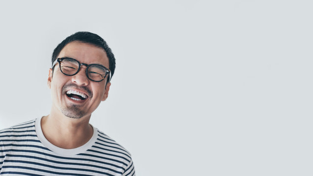 portrait young asian man wear eye glasses Smiling cheerful look thinking position with perfect clean skin posing on white background.fashion people freedom life style concept