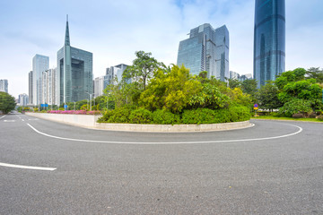 Fototapeta na wymiar asphalt pavement with modern urban background ,guangzhou ,China