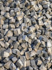 Large pile of gray paving stones, background texture structure