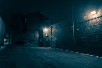 Dark and eerie urban city alley at night  - obrazy, fototapety, plakaty
