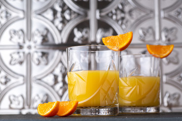 Orange juice in cut crystal glasses