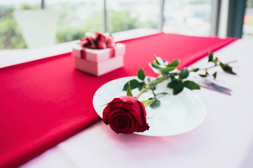 Romantic still life with pink champagne and beautiful red roses. Valentine's day concept. Soft focus