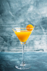 Sweet cocktail with kumquats on rustic background. Selective focus. Shallow depth of field.