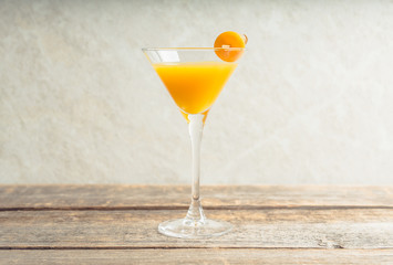 Sweet cocktail with kumquats on rustic background. Selective focus. Shallow depth of field.
