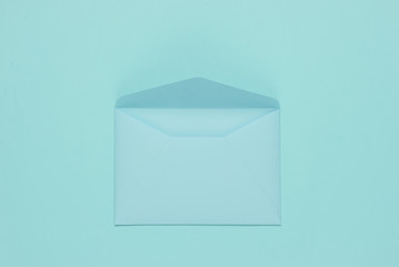 Open Envelope blue pastel color. Flat lay mockup for valentines day, wedding or birthday. Top view
