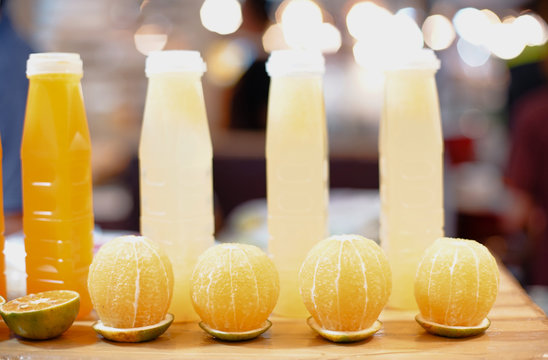 Raw oranage and orange jouce in bottle
