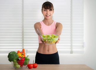 Asian girl eat clean food after exercise at home